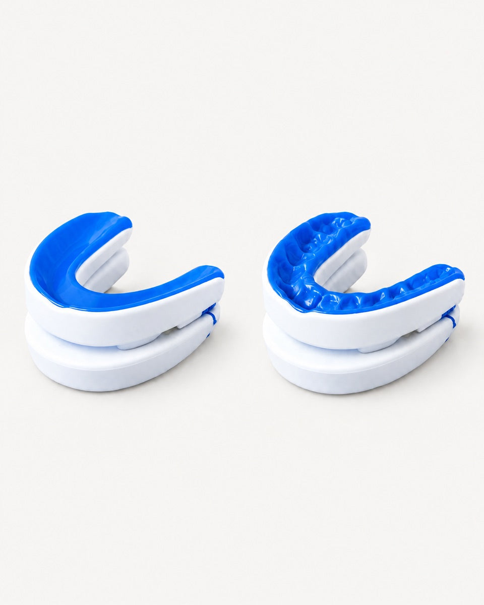 Two mouthguards side by side: one as it comes out of the box, one after molding, with the shape of teeth pressed into the lining.